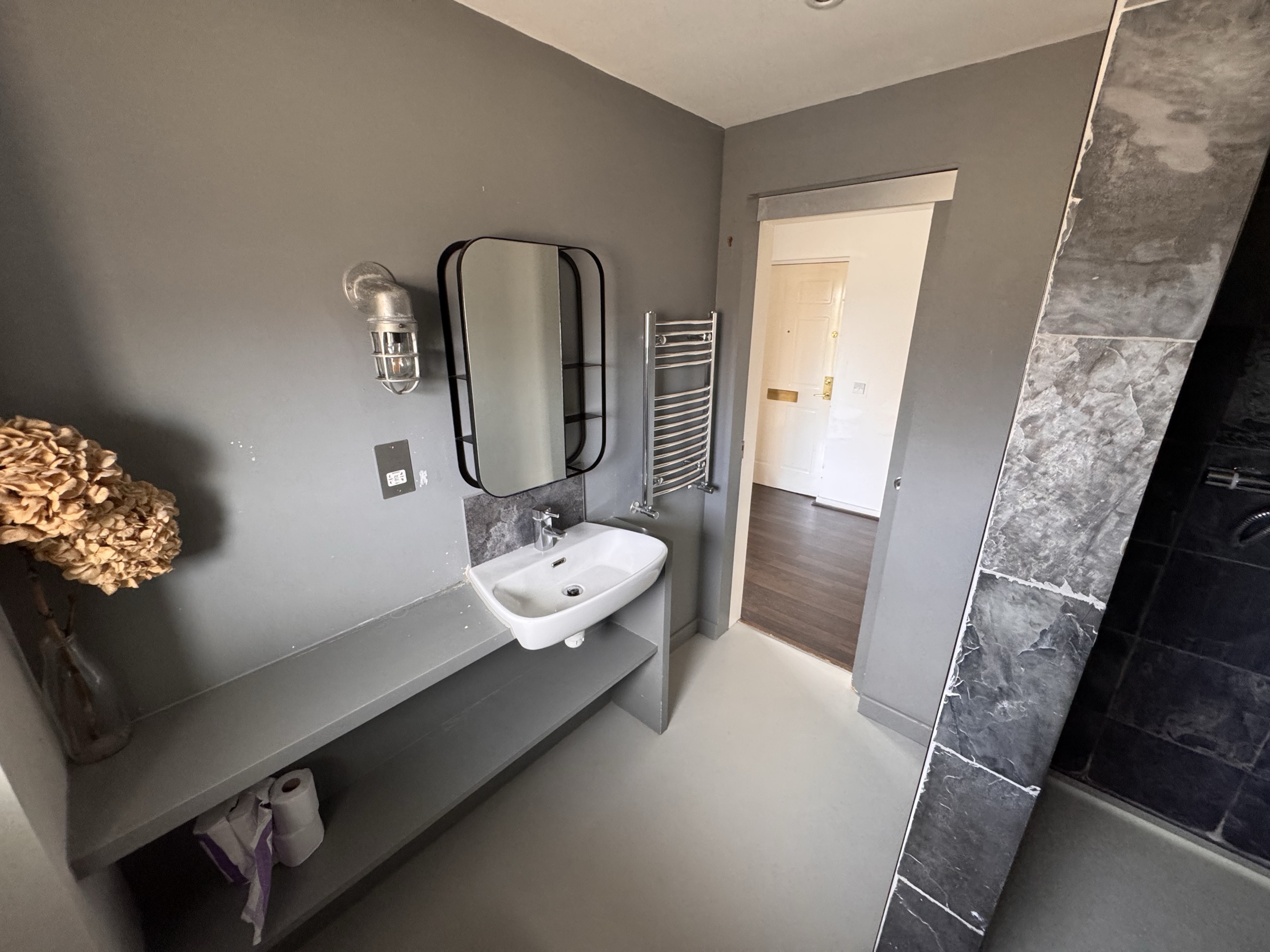 Modern shower room with heated towel rail