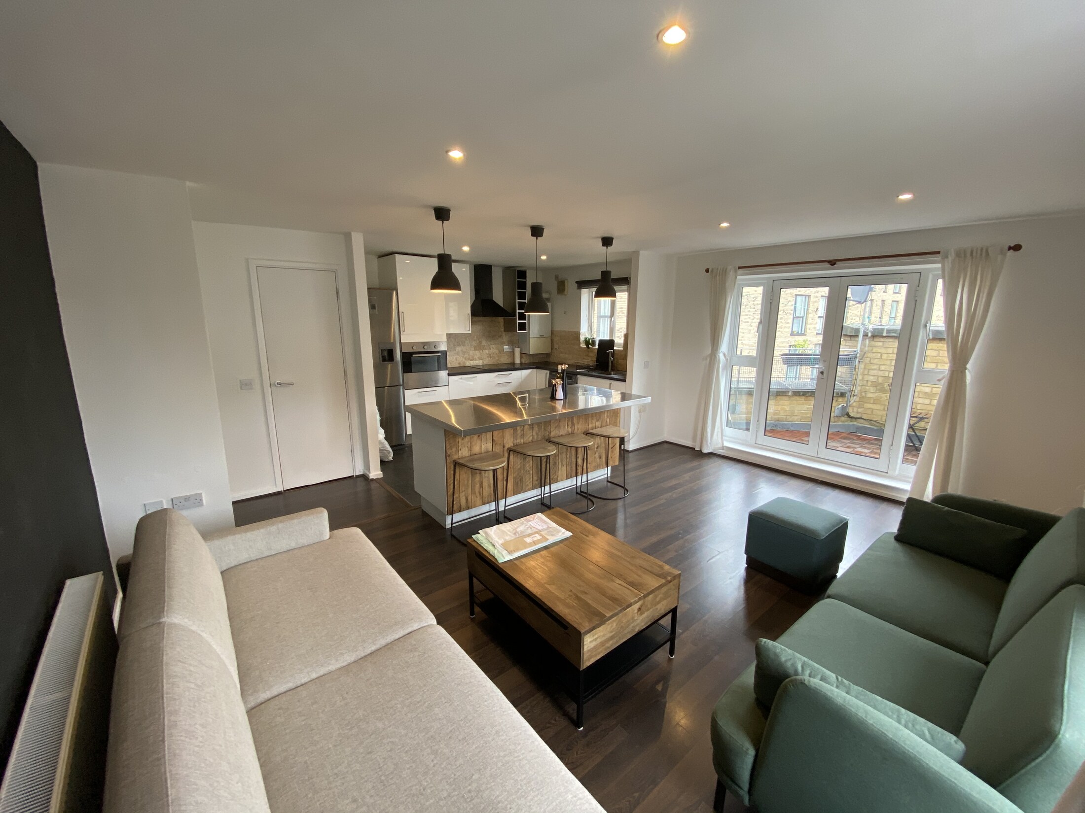 Living room seating area with light from the windows