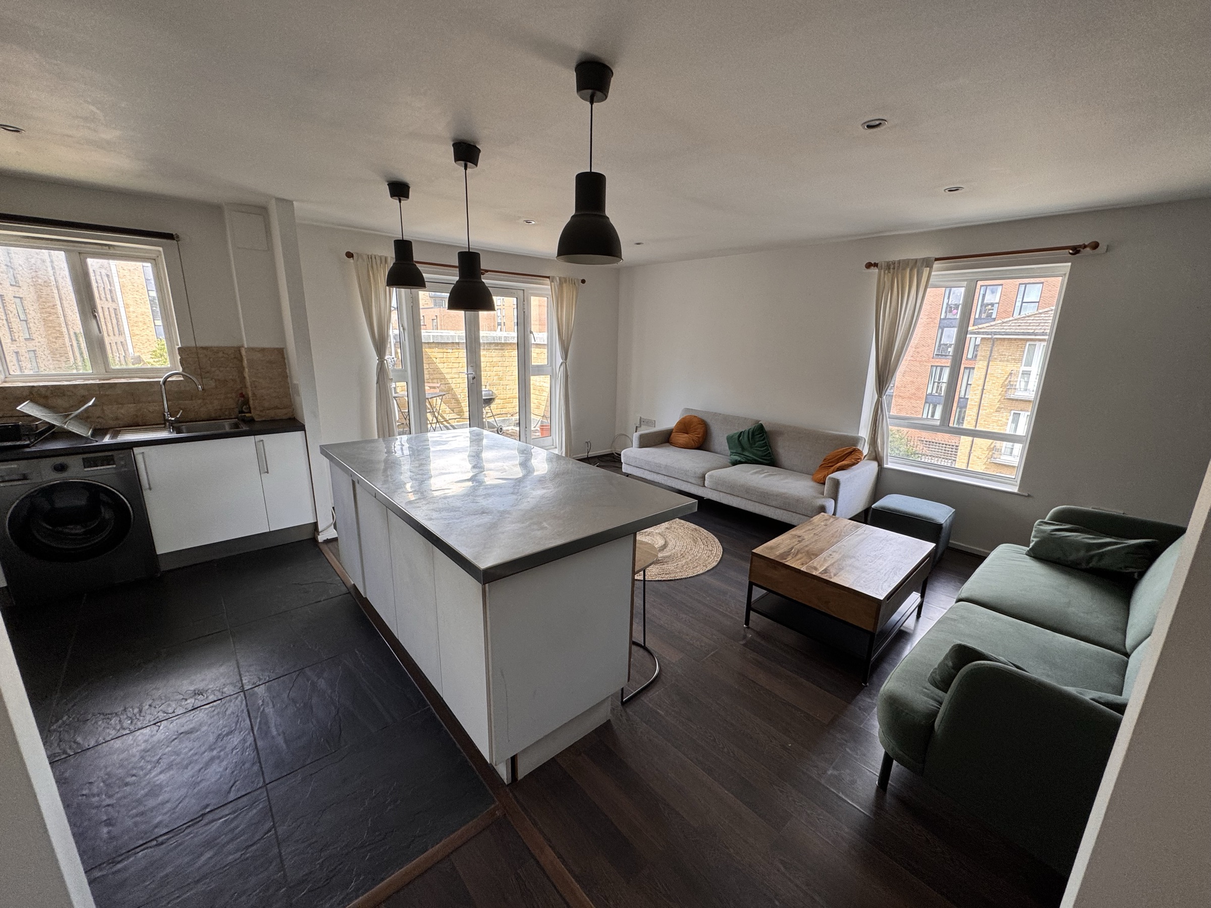 Open-plan kitchen and living room with central island
