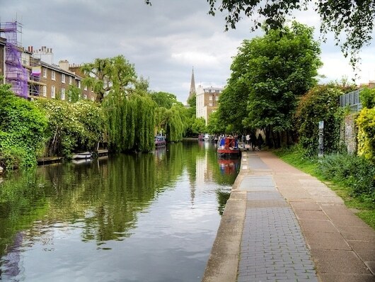 A leafy walking path beside Regent's Canal